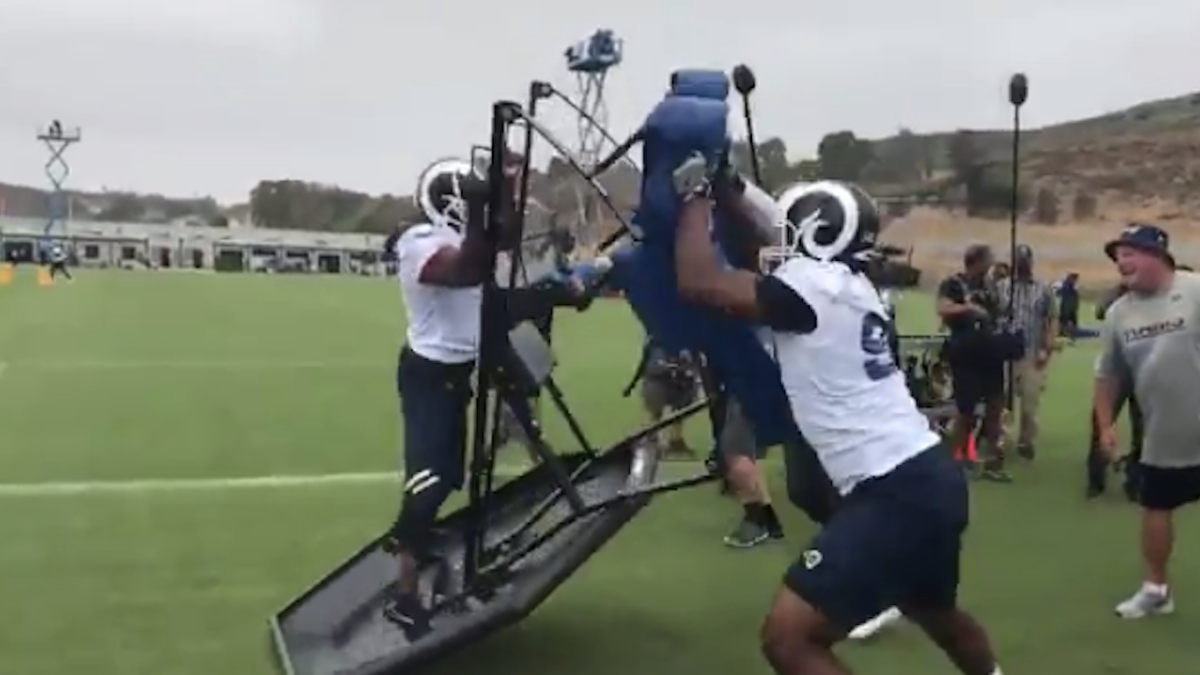 LOOK: Kevin Hart hangs on for dear life while riding blocking sled