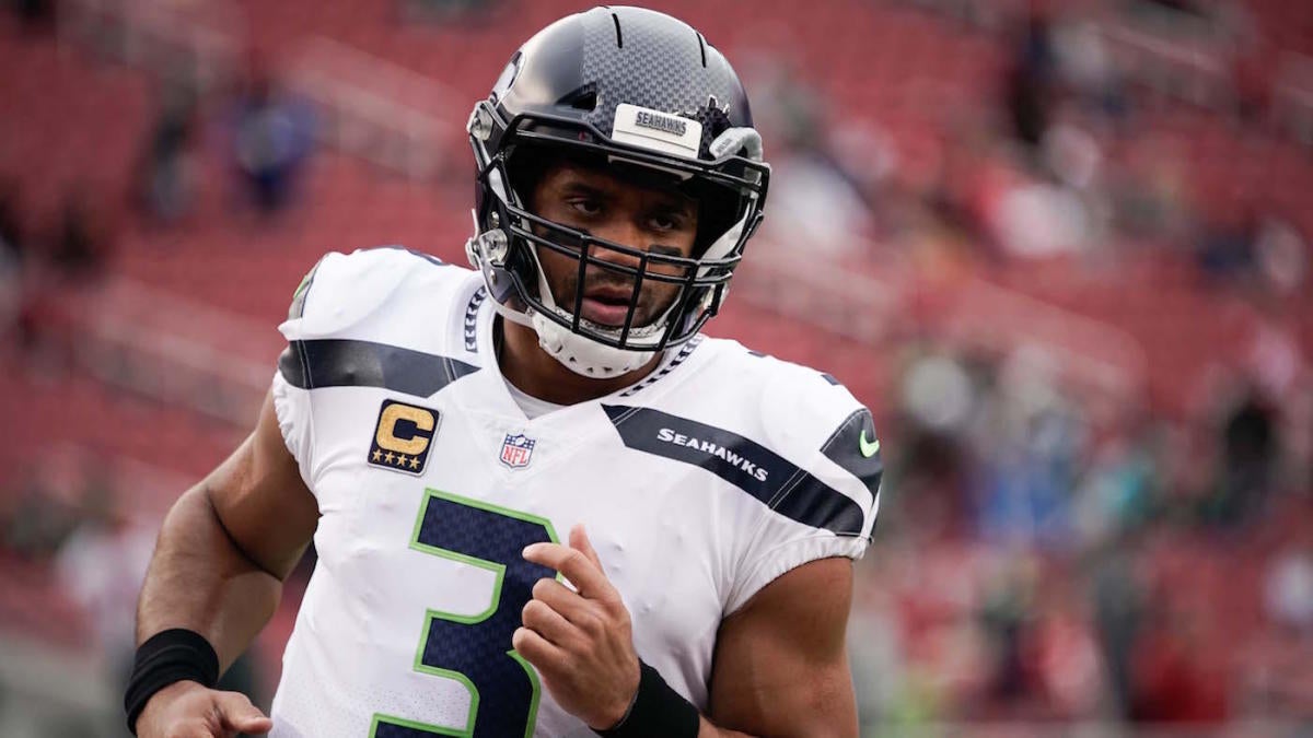 A Seattle Seahawks fan wearing a Russell Wilson jersey waves a towel next  to a Denver Broncos fan wearing a Russell Wilson jersey before an NFL  football game, Monday, Sept. 12, 2022