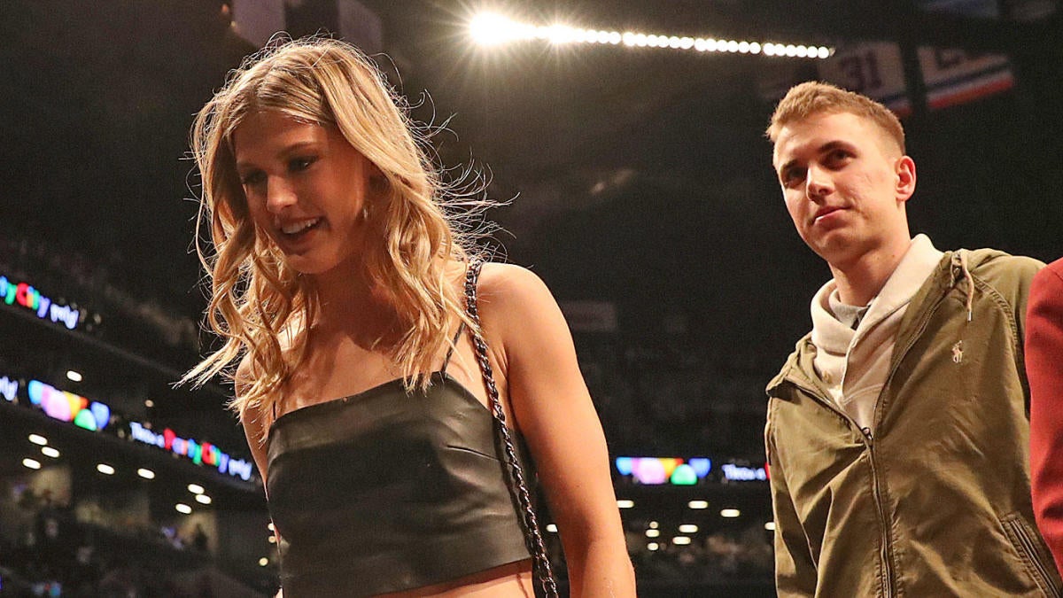 Tennis ace Eugenie Bouchard snapping relaxing with Super Bowl date to whom  she lost a Twitter bet earlier this year