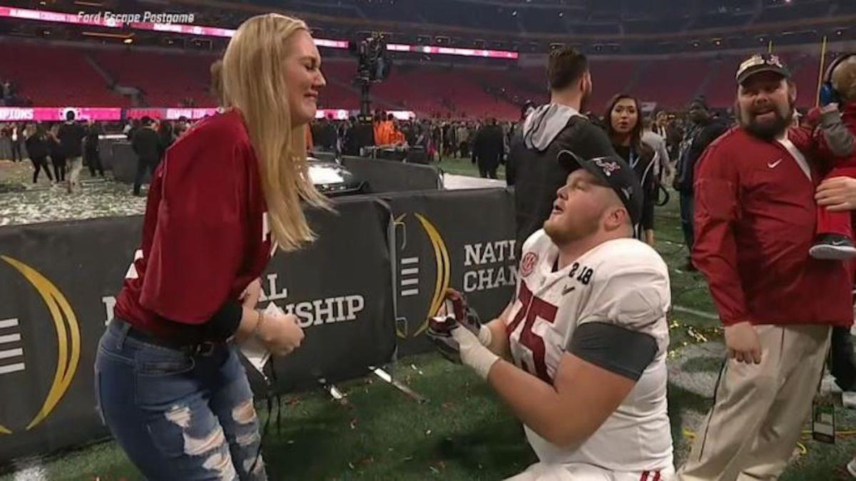LOOK Alabama center gets engaged on field after winning national