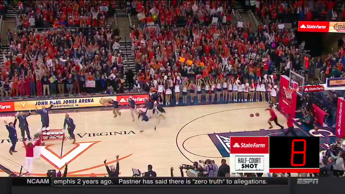WATCH Virginia fan sinks halfcourt shot to win 18K, sends crowd into a frenzy