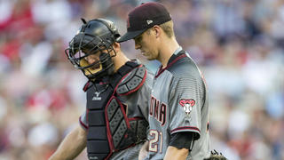 Miami Marlins catcher Jeff Mathis throws to first to put out San