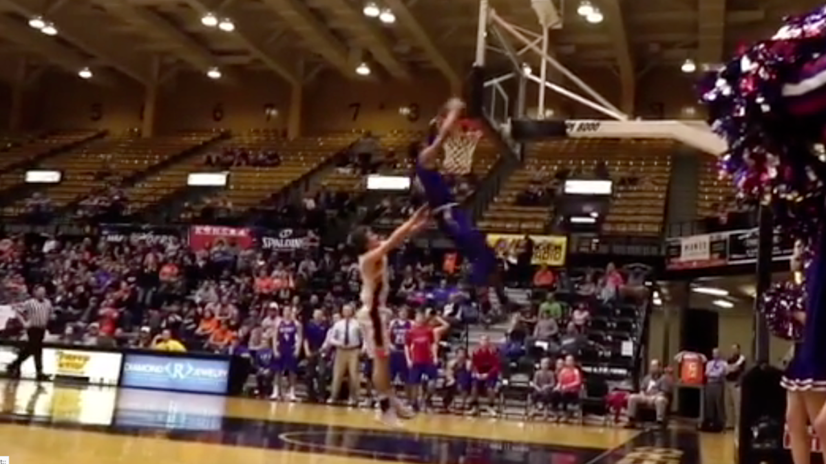 WATCH High school basketball player shoves a dunking opponent in the