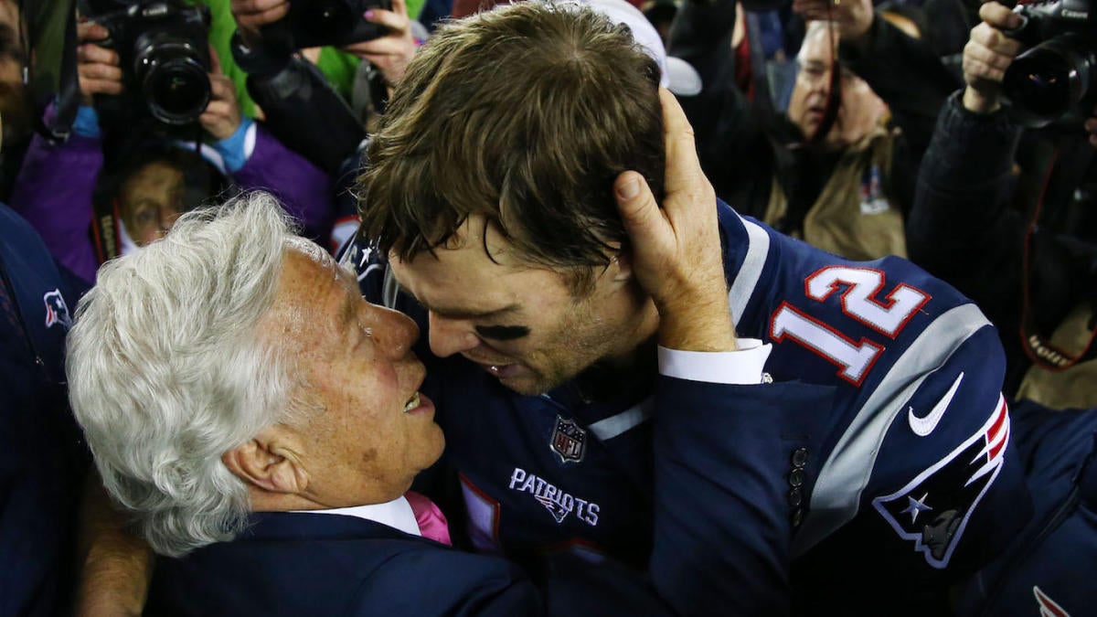 New England Patriots owner Robert Kraft talks with quarterback Tom