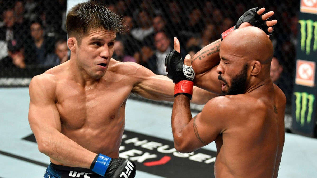 Henry Cejudo punching Mighty Mouse Johnson