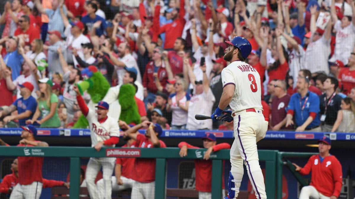 Phillies star Bryce Harper makes catch tumbling into photo pit in first  career start at first base - The San Diego Union-Tribune