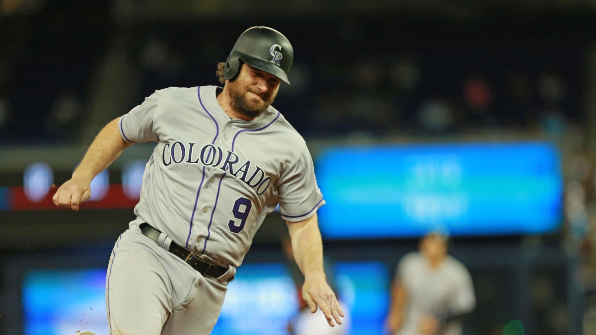 Colorado Rockies' Daniel Murphy (9) rounds second base after