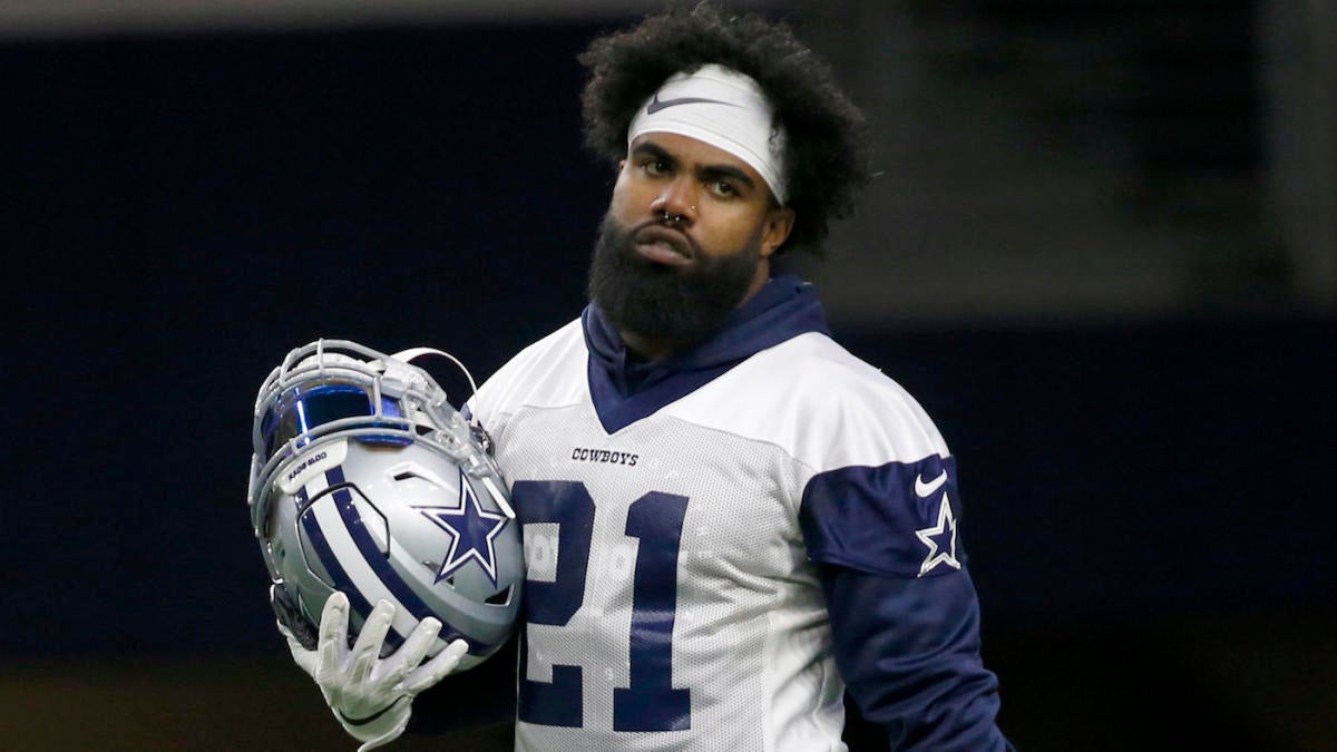 Dallas Cowboys NFL football first-round draft pick Ezekiel Elliott, poses  with his jersey in front of his locker at the team's training facility,  Friday, April 29, 2016, in Irving, Texas. (AP Photo/Tony