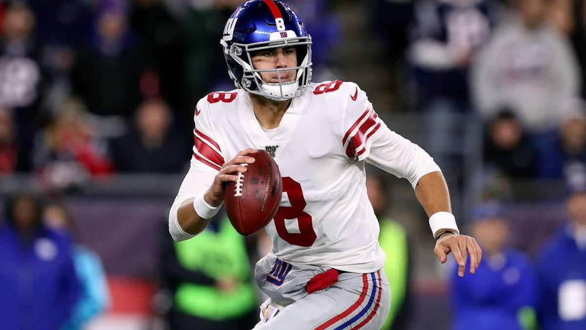 Giants Daniel Jones rolls out to his right to make a pass