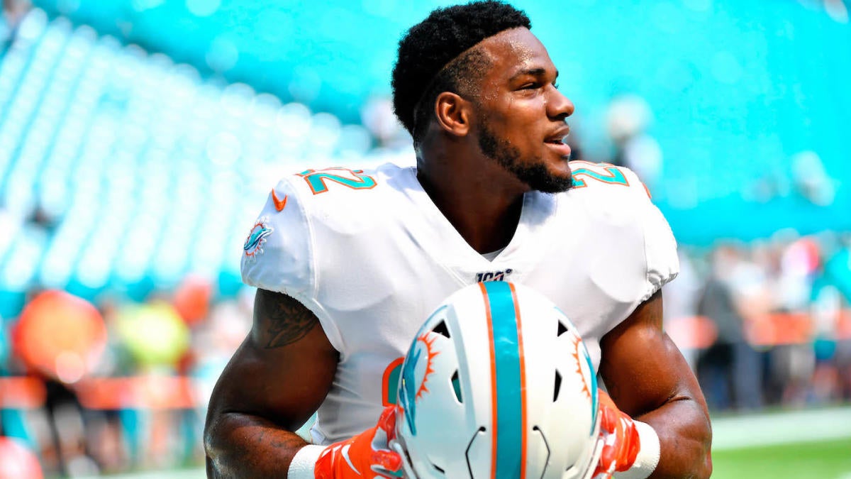 FILE - In this Sept. 8, 2019, file photo, Miami Dolphins running back Mark  Walton (22) warms up before an NFL football game against the Baltimore  Ravens, in Miami Gardens, Fla. The