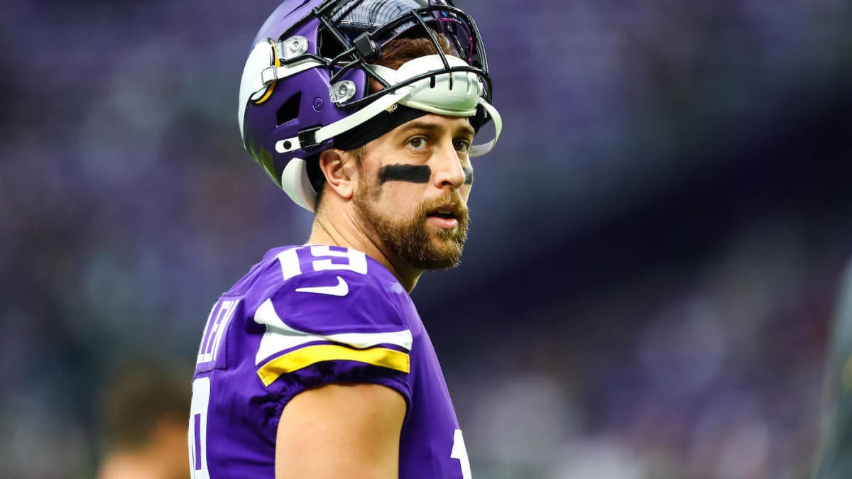 NFC wide receiver Adam Thielen (19), of the Minnesota Vikings, scores a  touchdown as AFC defensive back A.J. Buoy (21), of the Jacksonville Jaguars  defends, during the first half of the NFL