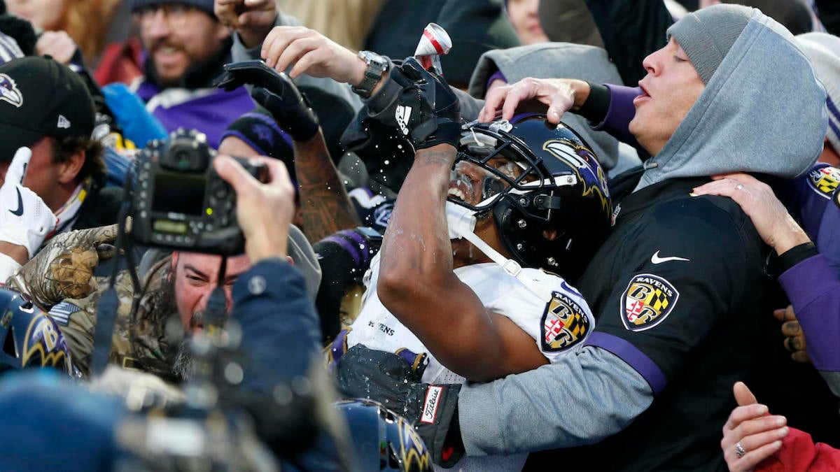 Marcus Peters chugs beer with fans in stands after saving Ravens' win