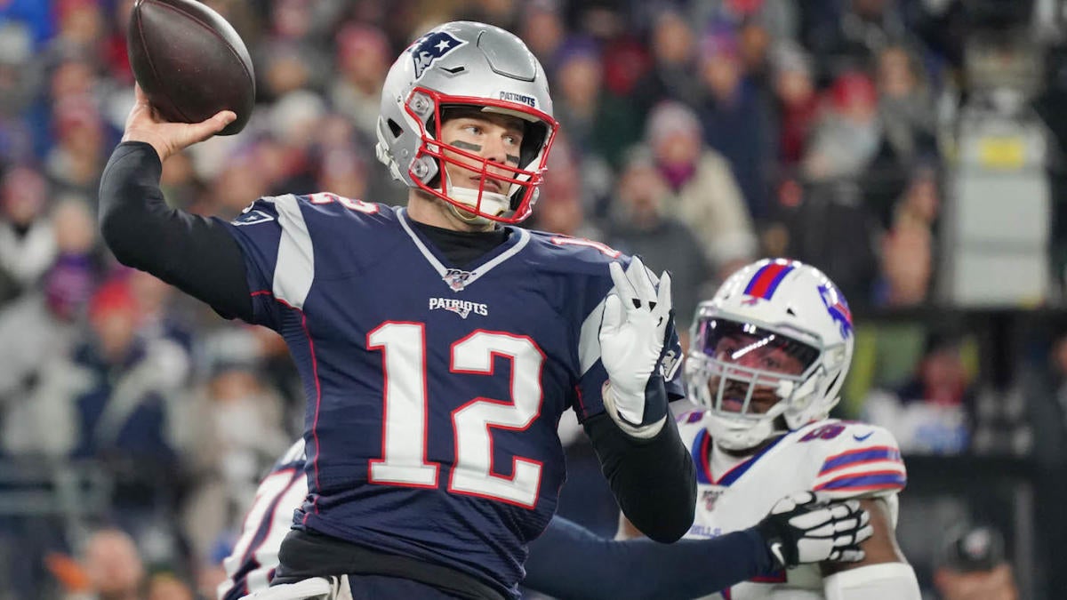 New England Patriots quarterback Tom Brady throws the ball upfield