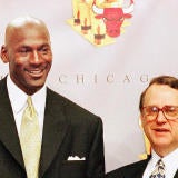 Michael Jordan (C) of the Chicago Bulls, holding h