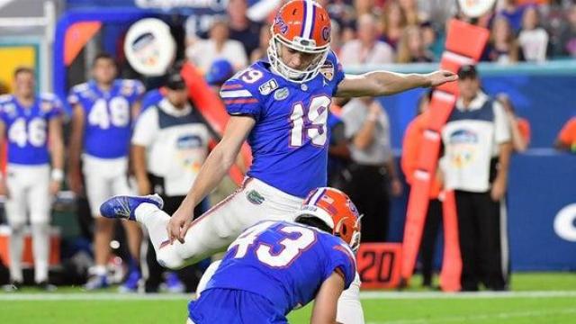 Nov 10 - Gainesville, FL, U.S.: Florida Gators place kicker Evan McPherson  (19) scores a PAT with Tommy Townsend holding during the second half of an  NCAA football game at against the