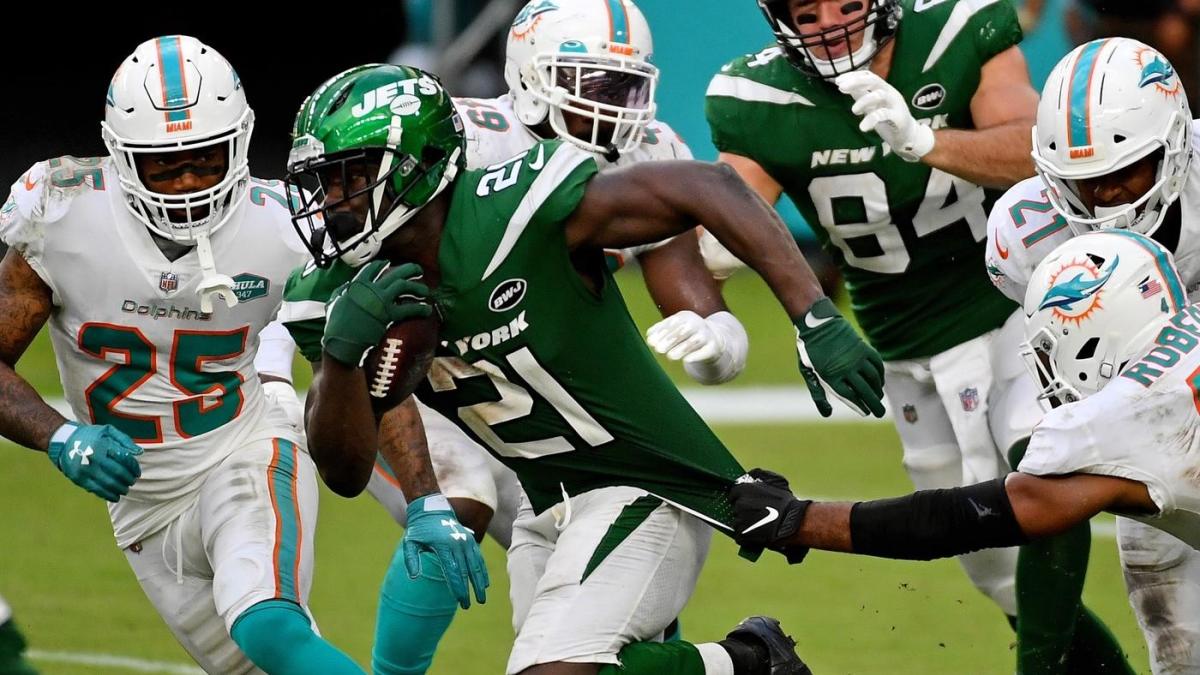 In this Monday, July 30, 2018, photo, running back Frank Gore (21) stands  on the field at the NFL football team's training camp in Davie, Fla. The  NFL's active career rushing leader