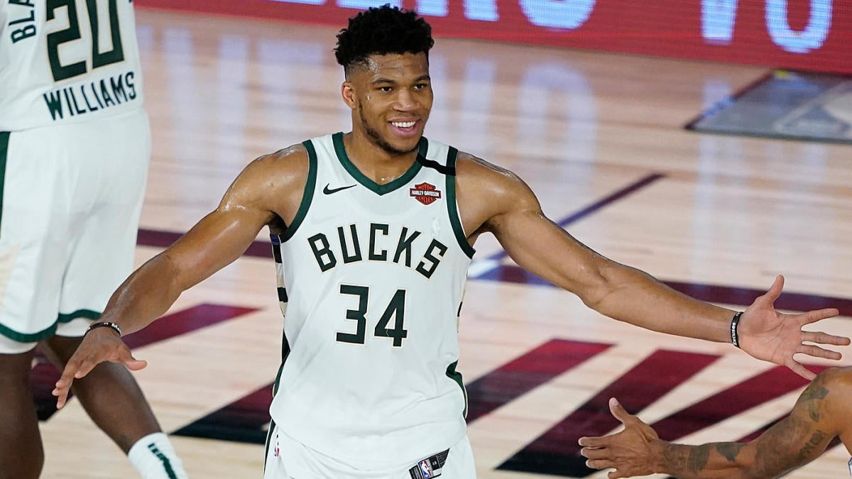 Bucks hero Giannis Antetokounmpo swaps basketball for soccer as he visits  Madrid and poses for photos with superstar Brazilian Vinicius Jr before  pair exchange signed jerseys