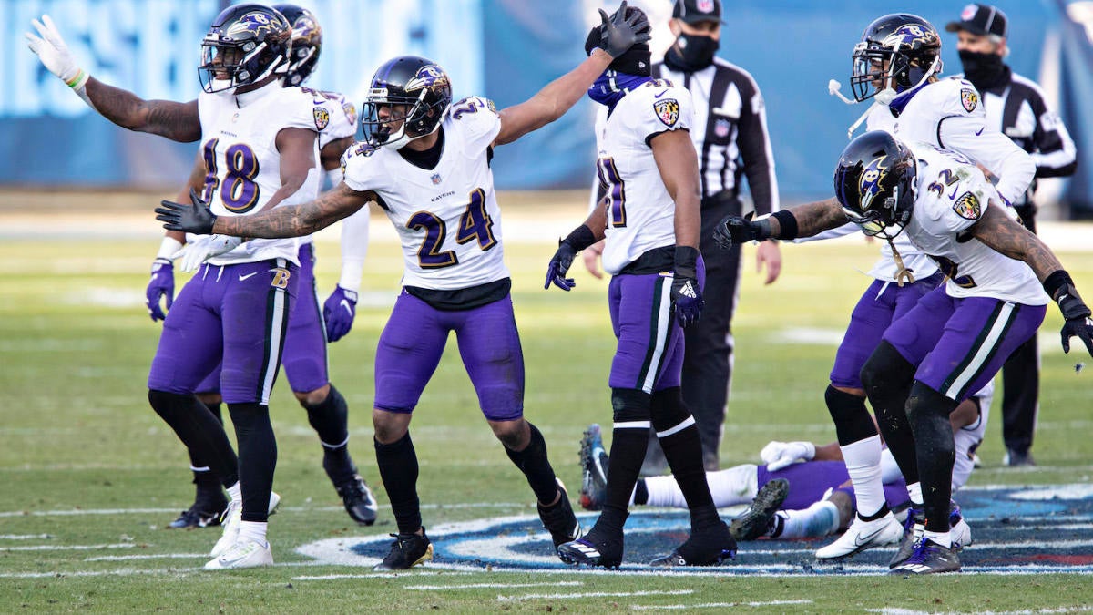 Baltimore Ravens cornerback Marcus Peters (24) hits Tennessee