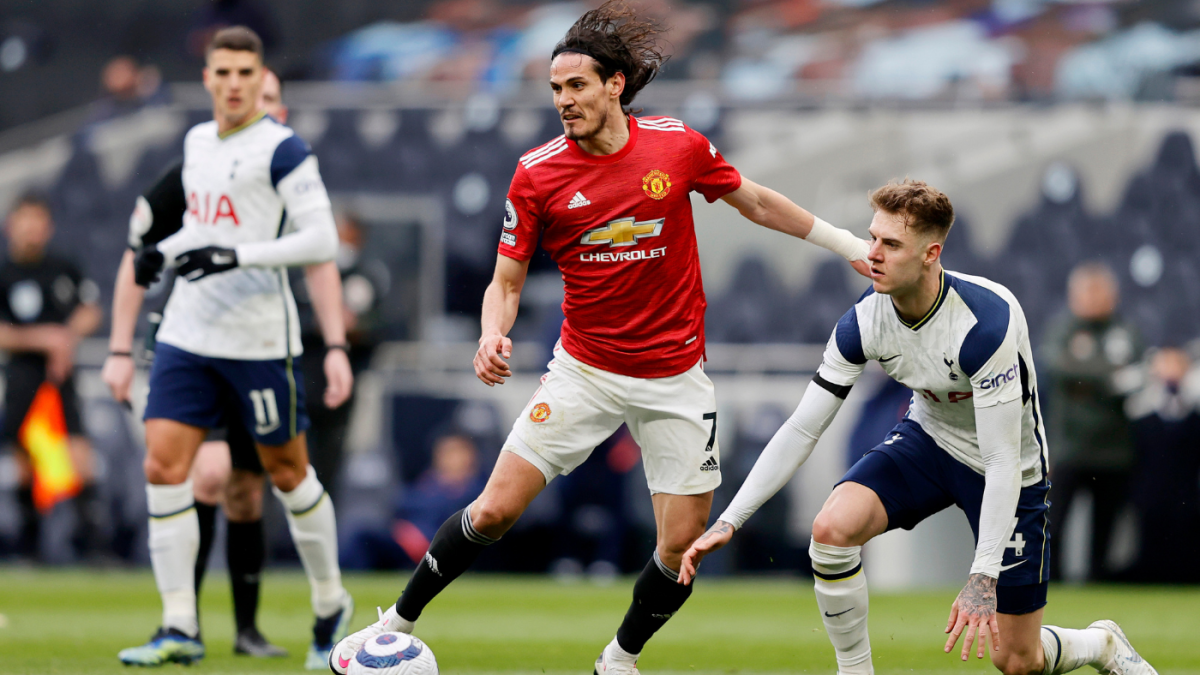 Manchester United's Edinson Cavani (left) fouls Tottenham Hotspurs