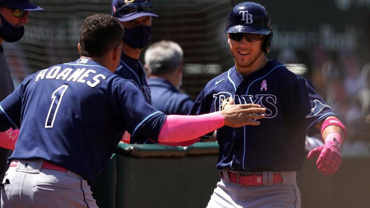 Tampa Bay Rays' Wander Franco, left, and Vidal Brujan, wearing a