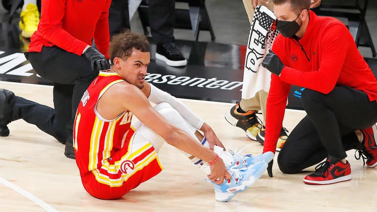 Hawks' Trae Young sprains ankle after stepping on referee ...