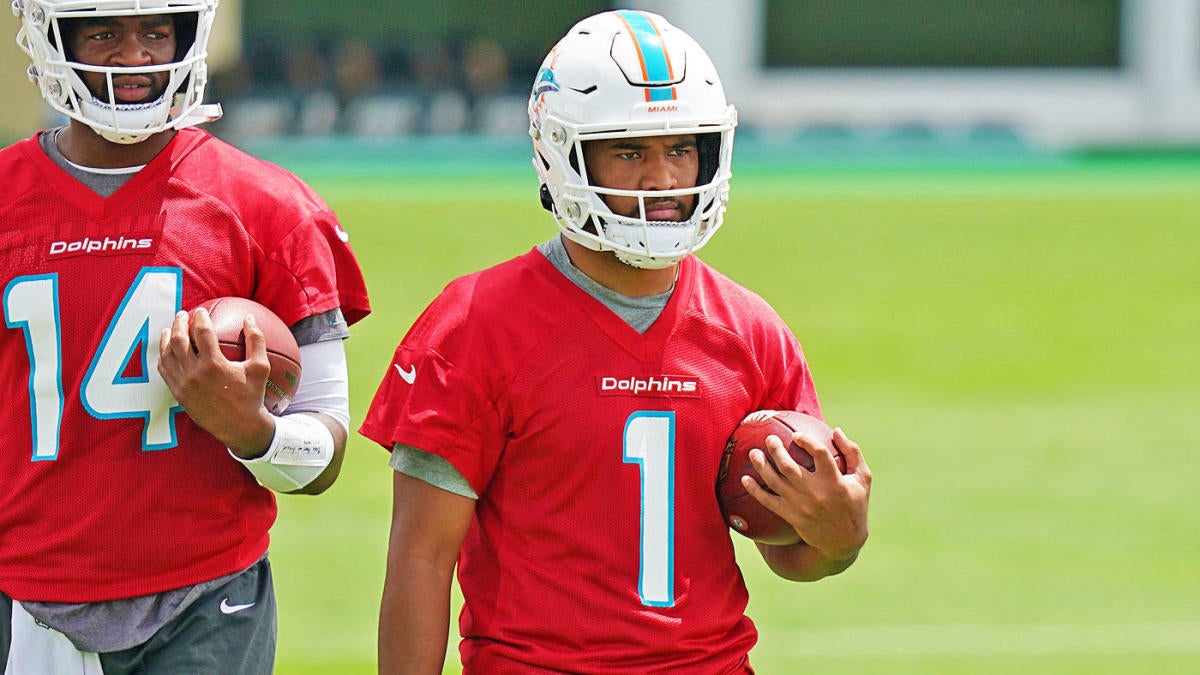 Miami Dolphins Tua putting helmet on as Jacoby Brissett goes down