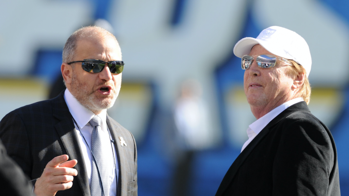 The Oakland Raiders' President Marc Badain, left, his wife Amy and