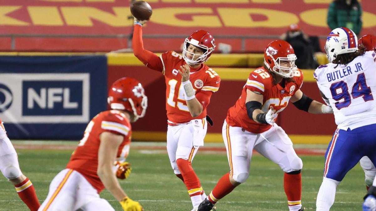 Patrick Mahomes throws a pass in a game against the Bills defensive line