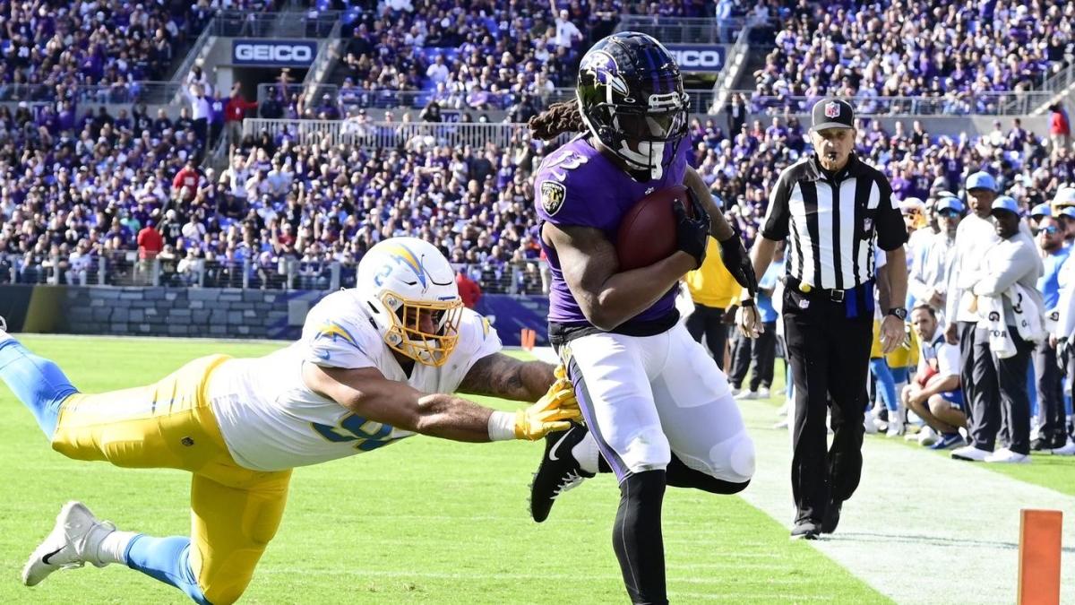 Baltimore Ravens running back Devonta Freeman (33) runs a play during the  first half of an NFL football game against the Miami Dolphins, Thursday,  Nov. 11, 2021, in Miami Gardens, Fla. (AP