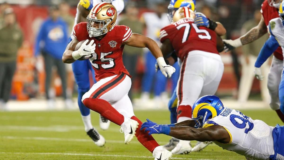 Elijah Mitchell of the San Francisco 49ers runs with the ball against