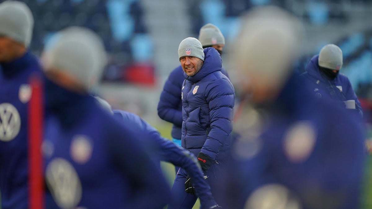 USMNT coach Gregg Berhalter takes selfie with fans during extreme cold conditions in World Cup qualifier