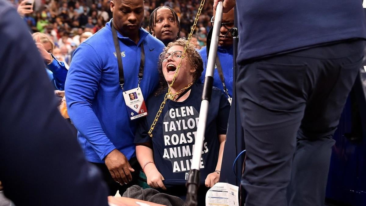 Glue Girl' Protests Timberwolves Owner by Sticking Self to NBA Court