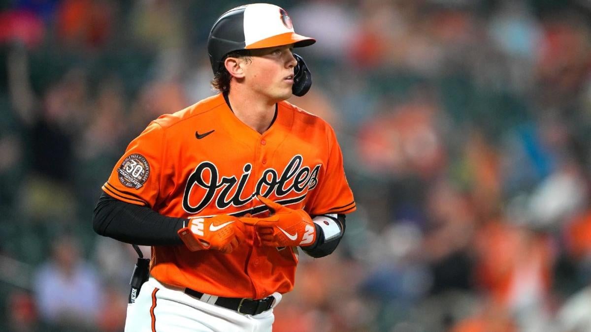 Adley Rutschman of the Baltimore Orioles and family walk during