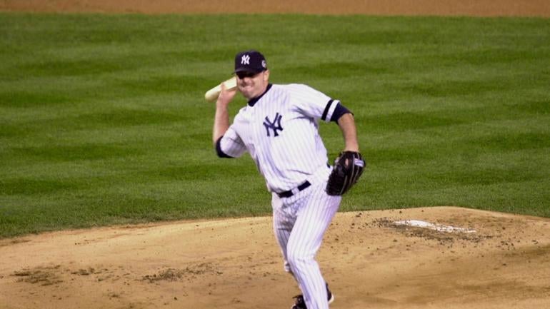 Yankee pitcher Roger Clemens throws a piece of broken bat ba