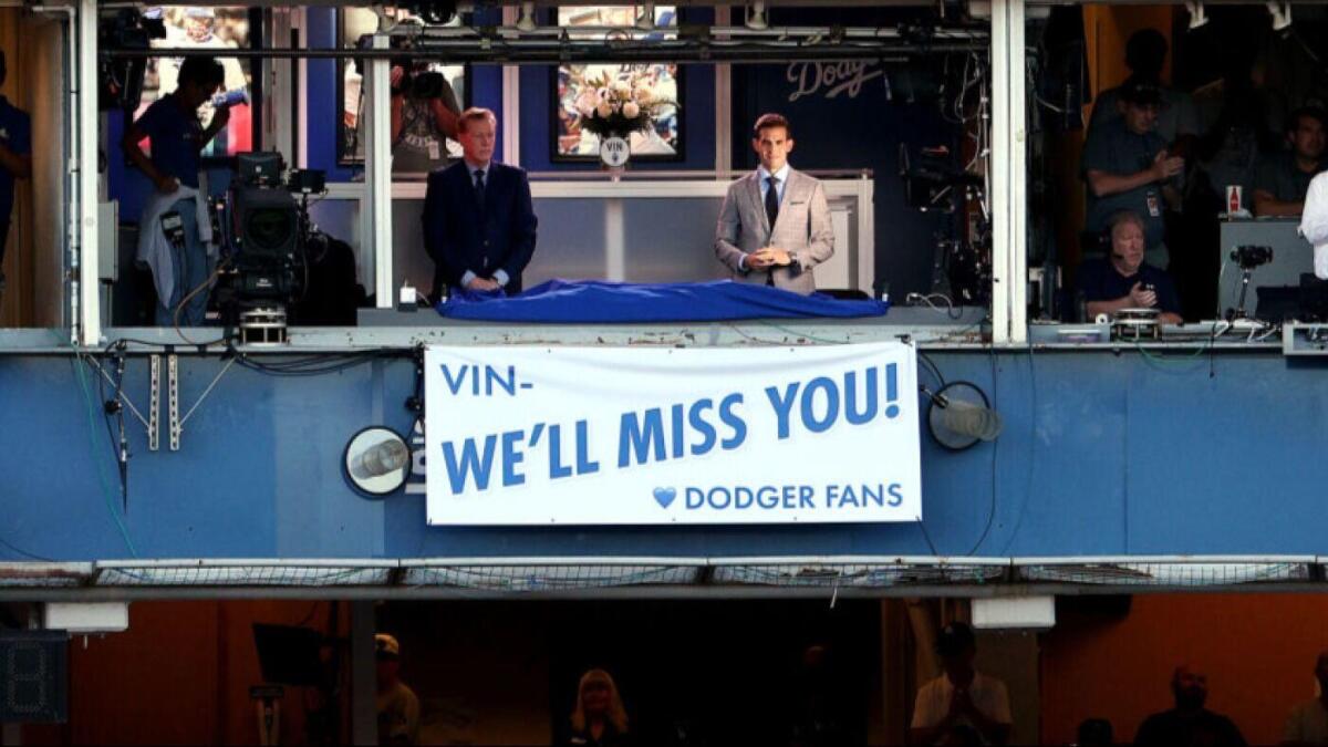 Scully honored with video tribute, banner at Dodger Stadium