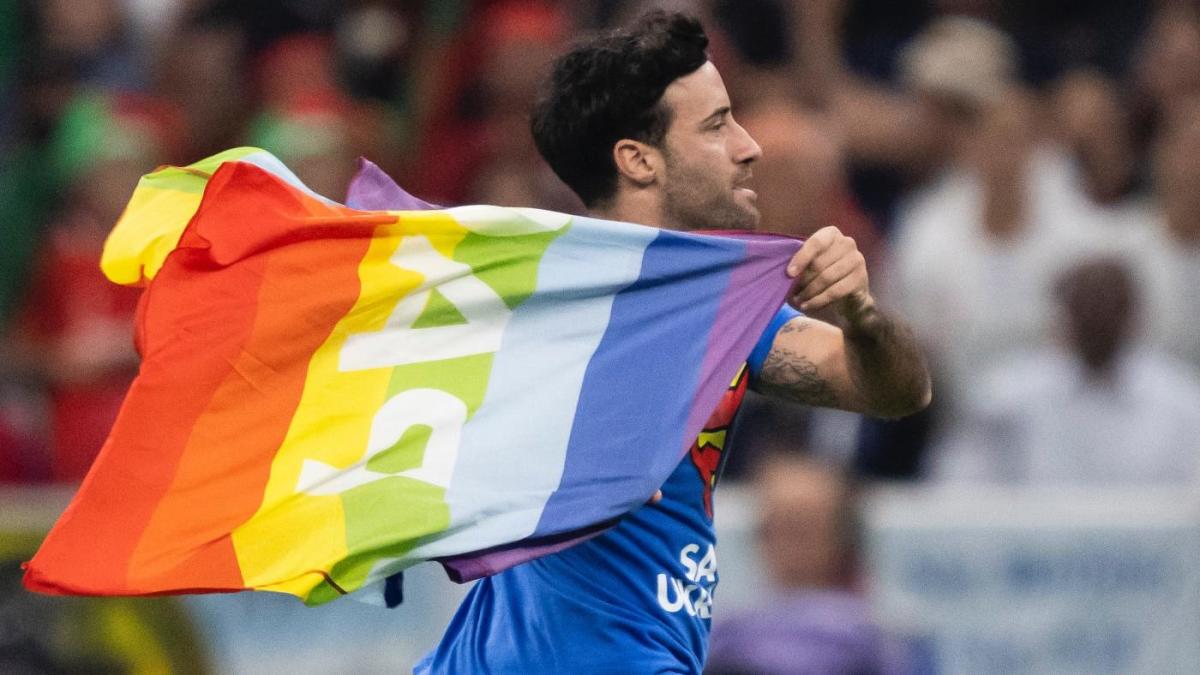 Pitch invader with rainbow flag interrupts World Cup match between Portugal  and Uruguay, Pro Sports