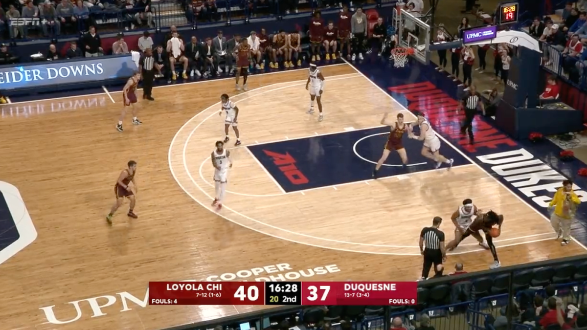 LOOK: College basketball game stopped after fake delivery man walks onto court in apparent prank