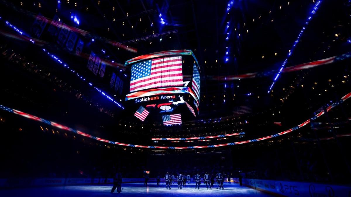 The Barenaked Ladies don Toronto Maple Leaf jerseys and sing the national  anthem on center ice before the game as the Leafs host the Ottawa Senators  on opening night of the new