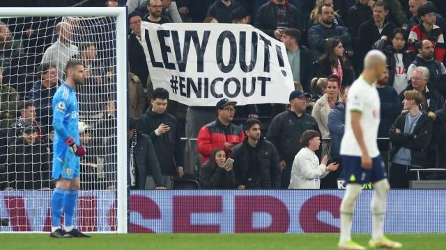 A fan in the stands holds up a Tottenham Hotspur's Son Heung-min