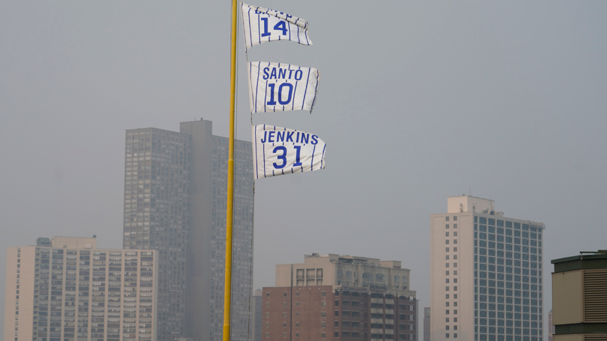 What led to MLB's decision to play Tuesday's Chicago Cubs game at Wrigley  Field in 'very unhealthy' air quality conditions?