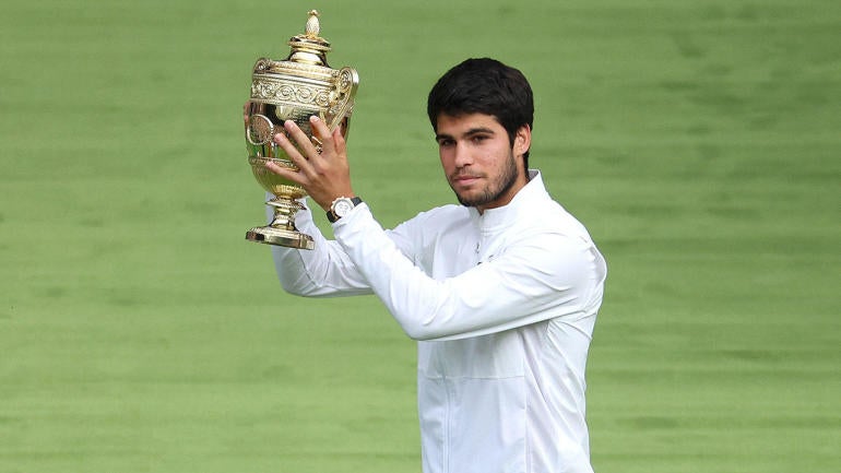 gettyimages-1548773428-carlos-alcaraz-lifts-2023-wimbledon-trophy-1400.jpg