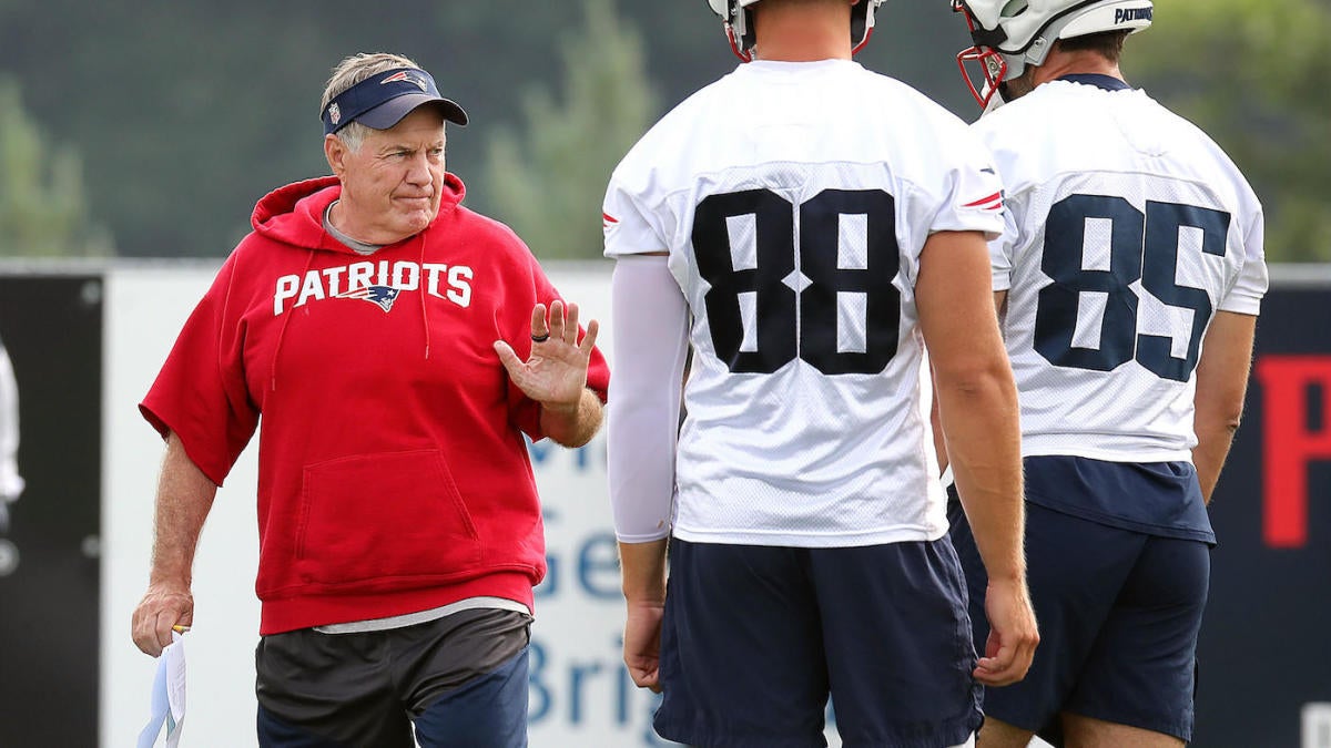 Here's why some Patriots players are wearing caps over their helmets during  training camp