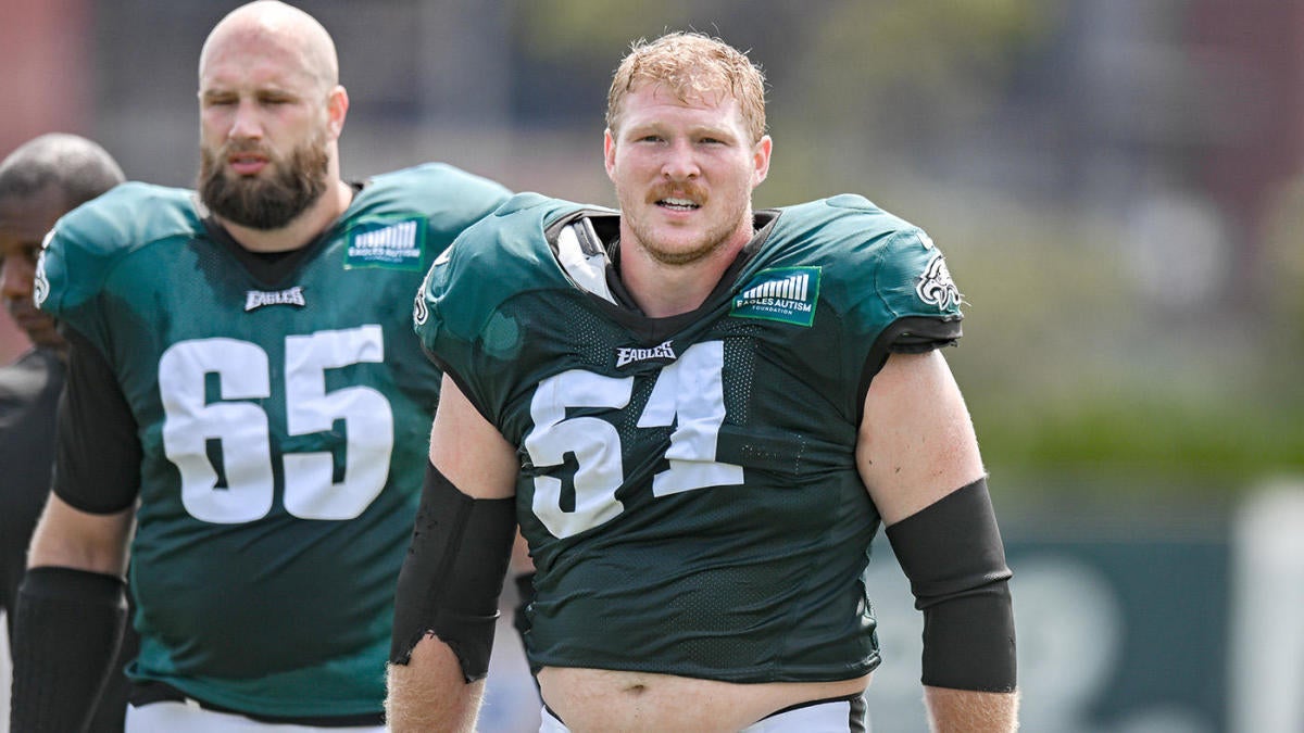 Philadelphia Eagles' Tanner McKee, left, talks to a member of the military  after handing over his jersey during practice at NFL football training  camp, Sunday, July 30, 2023, in Philadelphia. (AP Photo/Chris