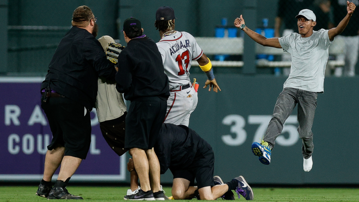Ronald Acuna Jr. tackled by fan at Coors Field during Rockies-Braves