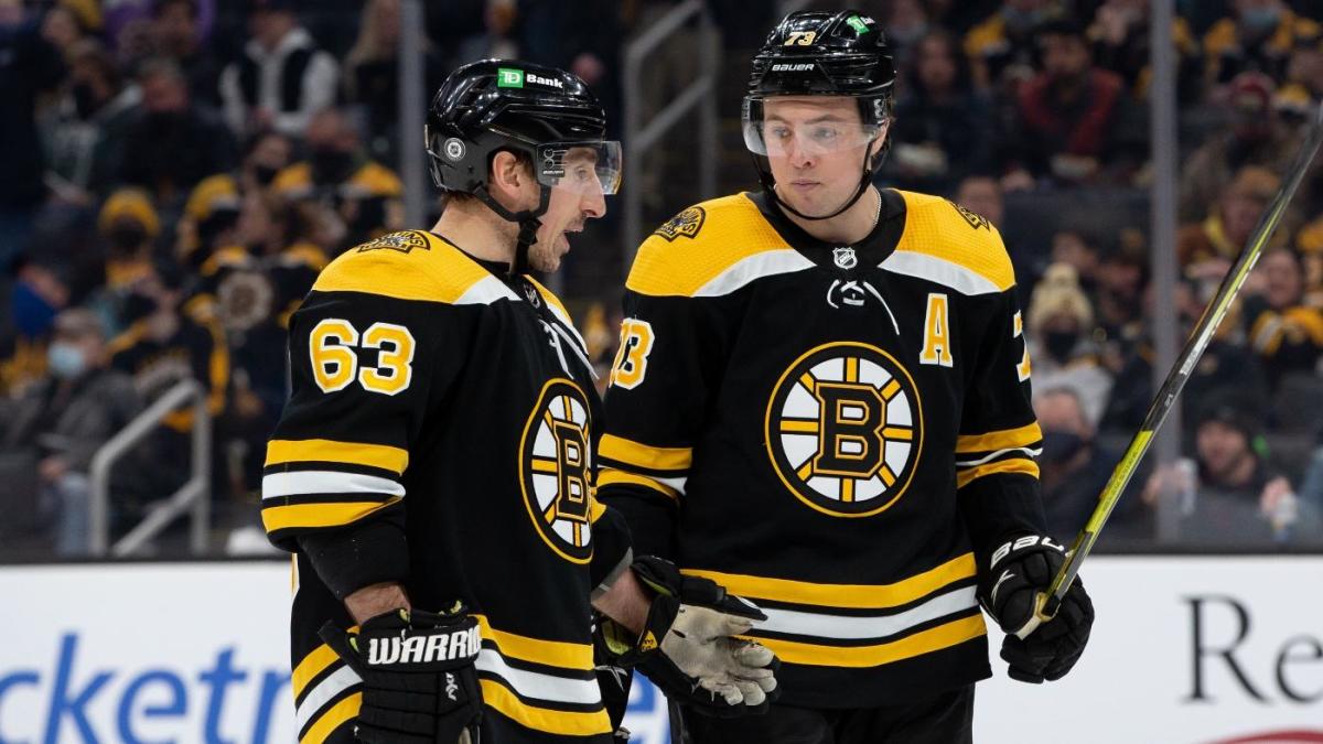 Milan Lucic of the Boston Bruins wears a camo jersey in the hallway News  Photo - Getty Images