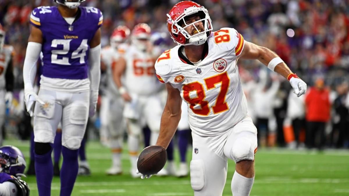 Kansas City Chiefs' Travis Kelce (87) walks the turf during the