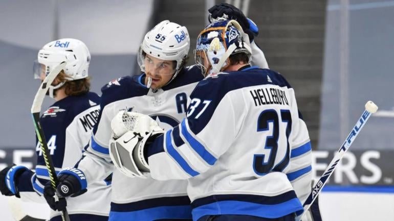 connor-hellebuyck-mark-scheifele-jets-getty.jpg