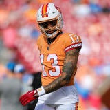 usatsi-21656433-mike-evans-bucs-wr-pregame-2023-1400-creamsicle-tangerine.jpg
