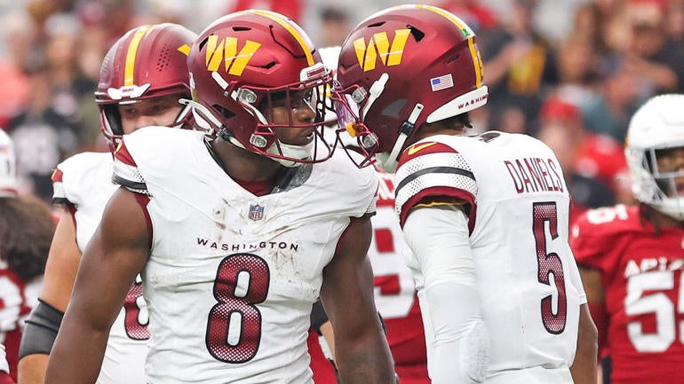 getty-brian-robinson-jayden-daniels-commanders.jpg