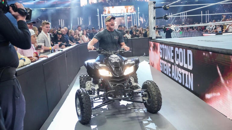 Steve Austin riding an ATV at WrestleMania